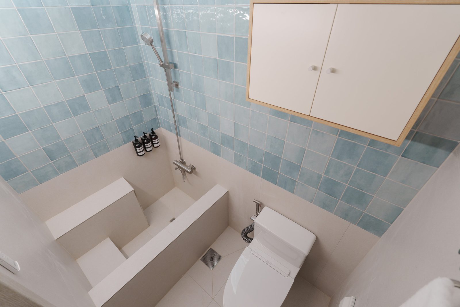 Shower room in pale blue tile